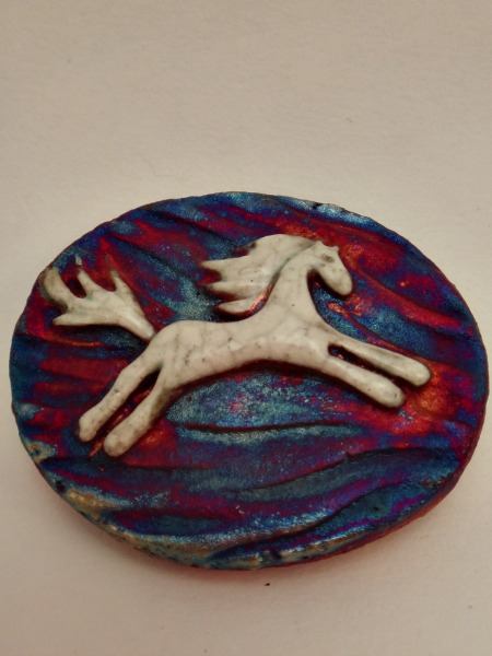 This beautiful Raku Pony Medallion is the perfect small & affordable gift for yourself or a loved one. On the back is the wonderful reminder "I Am Powerful." The Pony symbolizes personal drive, passion, & appetite for freedom.