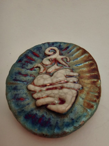 This beautiful Raku Sacred Heart Medallion is the perfect small and affordable gift for yourself or a loved one. On the back is inscribed as a wonderful reminder "I am loved."