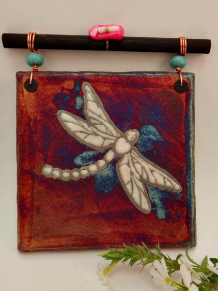 This beautiful Raku Dream Catcher Tile Dragonfly will hang perfectly in your home or work space as a symbol of change, transformation, & lightness of being.