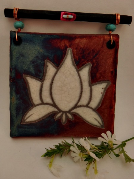 These stunning Lotus Art Raku Dreamcatcher tiles will surely liven up any home or work space. The lotus symbolizes rising from the muck to flourish and become reborn.