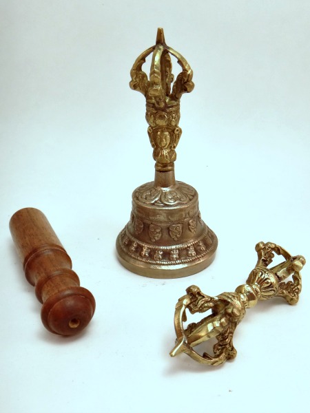The dorje, held in the right hand, represents skillful means, and the bell, held in the left, represents wisdom. Wisdom and compassion flow together.